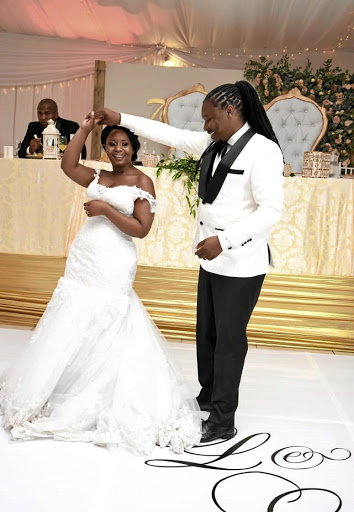 Liza and her husband Lonwabo Mbana dance at their wedding ceremony.