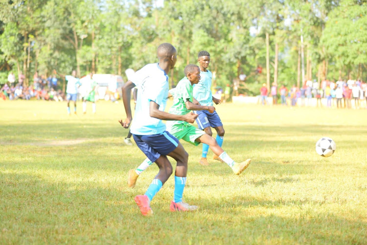 Action between Kisii Industrial and Matieko (green) during the boys' final