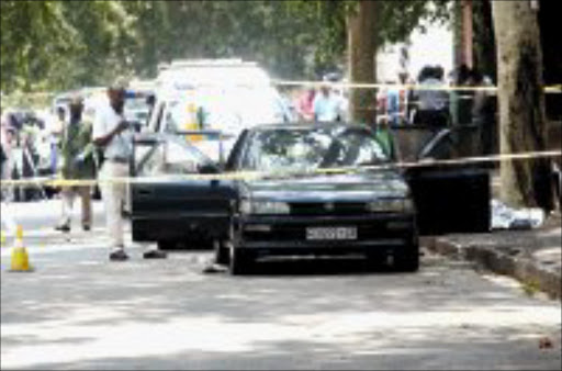 MAYHEM: Four men, including a policeman, were killed in a shootout in Yeoville. Seven other people were arrested. Pic. Veli NHlapo. 10/12/07. © Sowetan.