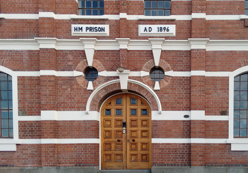 Found on the front wall of the former prison in central Dunedin, on the right side of the door, in the image.Transcription:NZ Historic Places Trust. 4035. Registered Building. Pouhere Taonga.More...