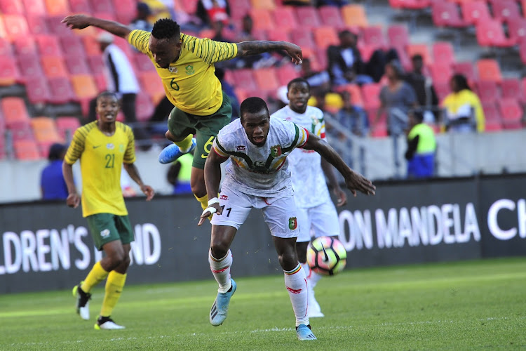 Lebohang Phiri of Bafana Bafana and Lassina Coullibala during the 2019 Nelson Mandela Challenge match between South Africa v Mali at Nelson Mandela Bay Stadium - Port Elizabeth on 13 October 2019.