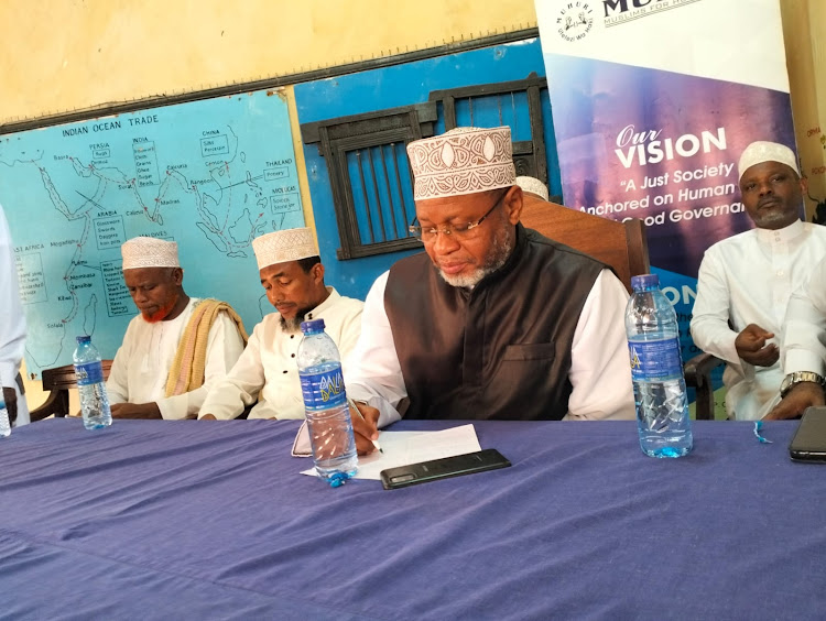 Chief Kadhi, Athman Abdulhalim Hussein accompanied by other Muslim leaders during an event at the Lamu Fort in Lamu county.