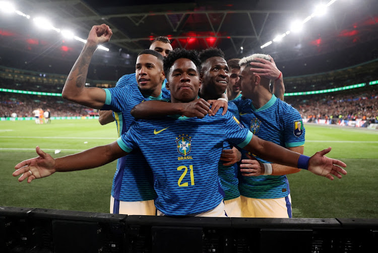 Brazil's Endrick celebrates scoring with Vinicius Junior and other teammates in the international friendly against England at Wembley Stadium in London on Saturday night.