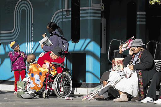 Patients wait for transport outside Charlotte Maxeke Johannesburg Academic Hospital yesterday Picture: DANIEL BORN