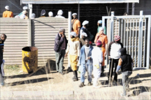 NOT TAKING CHANCES: Employees at the Vereeniging abattoir leaving after a person died and six others were hospitalised from inhaling deadly gas.PHOTO: LEN KUMALO. 24/06/2010. © Sowetan.