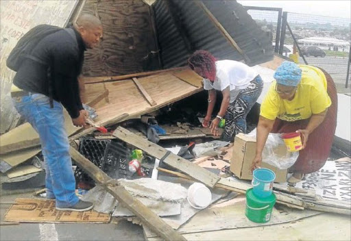 MAJOR BLOW: Hawkers trading outside the Shoprite premises in Mdantsane were removed by law-enforcement officials. The hawkers claim they were not given any notice Picture: MBALI TANANA
