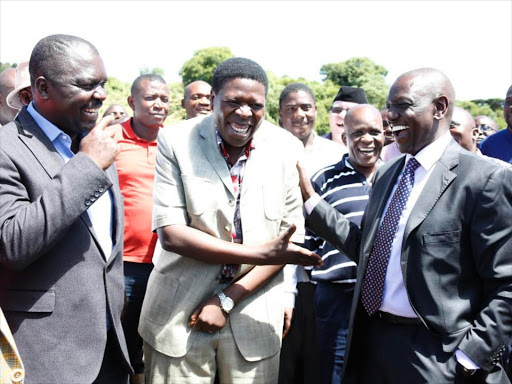 Deputy President William Ruto in a jovial mood with Water CS Eugene Wamalwa and Navakhalo Mp Emmanuel Wangwe at Turob area after attending a Church service at ACK St.Joseph in Kipkaren on Sunday.pic\Charles Kimani\DPPS