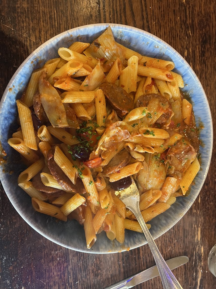 Gluten free penne arrabiata with substituted sausage.