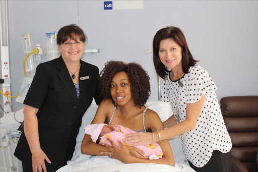Tshepiso Mbambisa and her baby Julile, flanked by the general manager of Netcare Olivedale Hospital, Bets Welman and Netcare Olivedale Hospital client liaison officer Deborah Sieff Picture: Netcare Olivedale Hospital