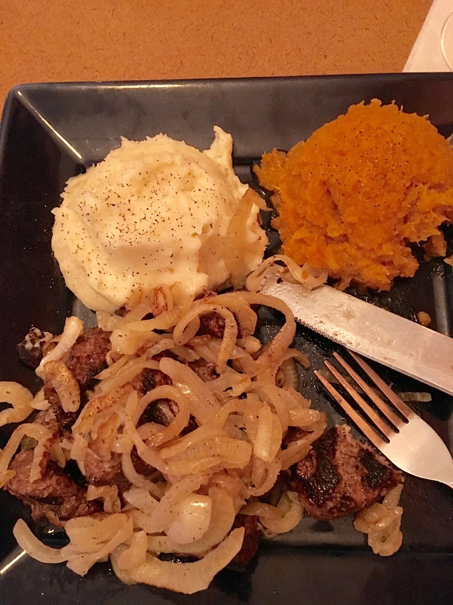 Beef tips with onions, mashed potatoes and squash