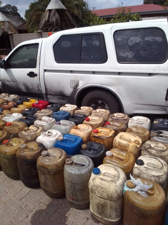 The three suspects caught with diesel on these containers in Ogies could not produce the proof of purchase.