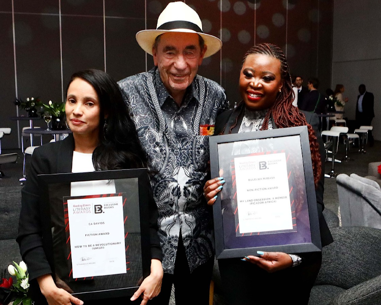 Winner of the fiction award CA Davids, left, and nonfiction winner Bulelwa Mabasa with justice Albie Sachs at the Sunday Times Literary Awards function at The Empire in Johannesburg.