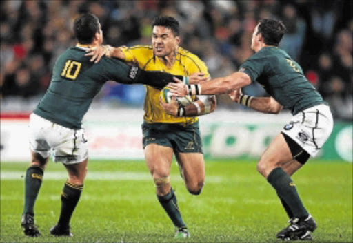 Digby Ioane of the Wallabies runs the ball during his side's trouncing of the Springboks in the Tri-Nations match in Sydney on Saturday Picture: MARK NOLAN/GALLO IMAGES