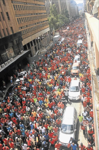 CROWD PULLER: Workers under the banner of Cosatu protest in Johannesburg city centre recently. PHOTO: PUXLEY MAKGATHO
