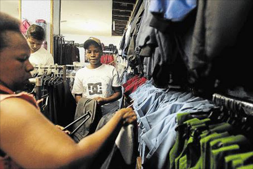 LAST-MINUTE RUSH: JANUARY 09, 2016 The jolly season is over and parents went out in their numbers to purchase school uniforms for their children as the back to school bell rings next week. Thoneka Jama and her son Kwandiwe Jama shop for new Selborne College school apparel on Friday