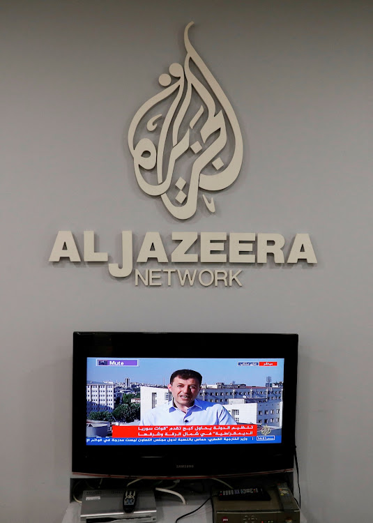 The logo of Qatar-based Al-Jazeera network is seen in one of their offices in Jerusalem June 13, 2017.