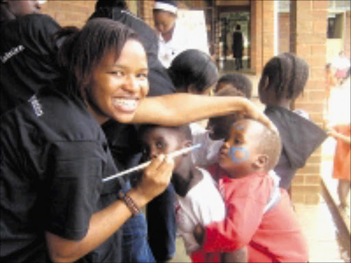 CHEERS: CAB members having fun with the children of Philani Orphanage during their Christmas party. 03/12/08. © Sowetan.