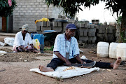 Mariana Ubisi and Ernesto Ubisi, parents of Vote Ubisi work at their home in Lillydale.