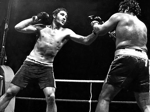 Gerrie Coetzee, left, throws a punch at Mike Schutte during their dirty fight in 1976.