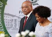 South African President Jacob Zuma (L) and National Assembly speaker Baleka Mbete (R) arrive for the President's State of the Nation Address on February 11, 2016 in Cape Town. Picture Credit: Mike Hutchings