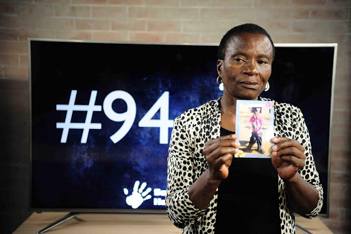 Miriam Monyane holds a picture of her son Thabo, 32, who died at the Steve Biko Academic Hospital after he got sick at Cullinan Care and Rehabilitation Centre.