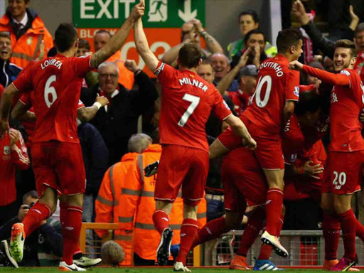 Liverpool players celebrate Origi's goal