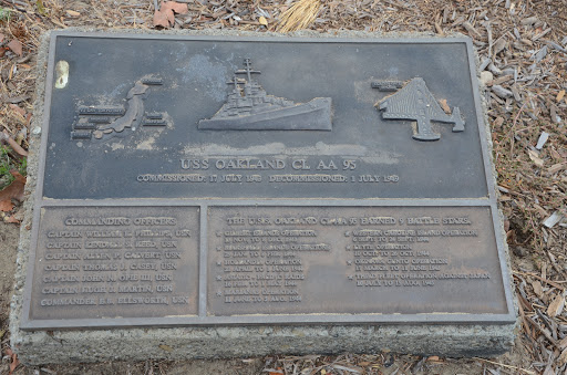 One of two plaques near the mast of the USS Oakland.