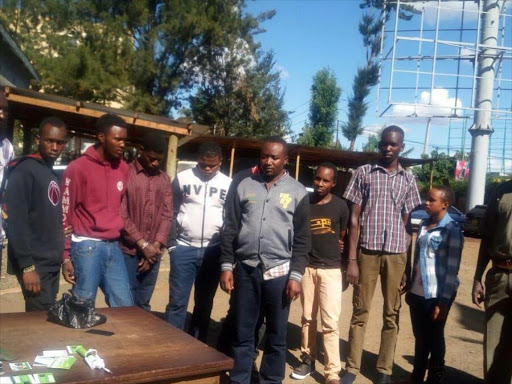 Some of suspected M-Pesa fraudsters who were arrested in Eldoret on March 29, 2017. /MATHEWS NDANYI