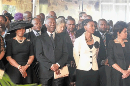 LAST RESPECTS: Former president Thabo Mbeki, his wife Zanele, United Democratic Front leader Bantu Holomisa and Minister of Defence and Military Veterans Lindiwe Sisulu, right, at the funeral of Fikile Bam in Tsolo, Eastern Cape, yesterday. Photo: Daily Dispatch