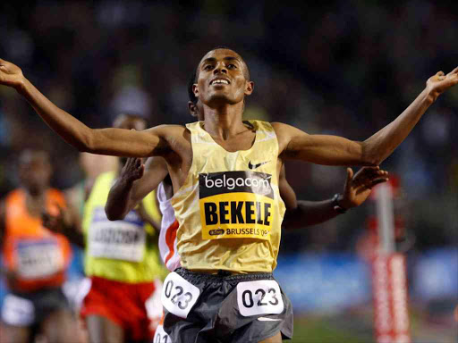 Kenenisa Bekele of Ethiopia crosses the finish line to win the men's 5000m race at the IAAF Golden League Memorial Van Damme athletics meeting in Brussels September 4, 2009. /REUTERS