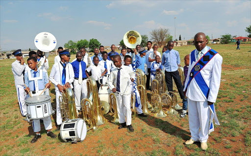 CLEAN LIFE: Mzwakhe Msibi, a former drug addict with members of his band. Msibi now helps nyaope addicts. He uses the band to keep addicts away from drugs. The band is currently a mixture of drug addicts and other young people in the community Photo: Veli Nhlapo