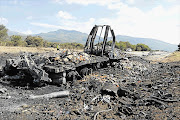 The burnt-out remains of a truck that exploded on the N1 highway between Mokopane and Polokwane, Limpopo, in the early hours of yesterday morning, killing four policemen and a truck driver.