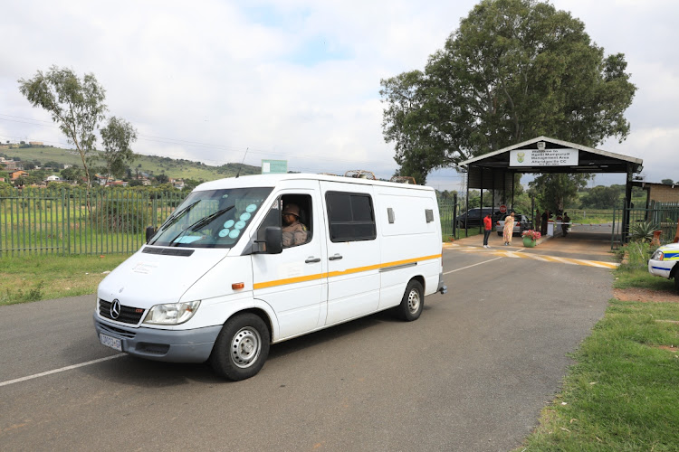 A Department of Correctional Services vehicle suspected to be transporting Oscar Pistorius is seen leaving the Kgoši Mampuru II management area.
