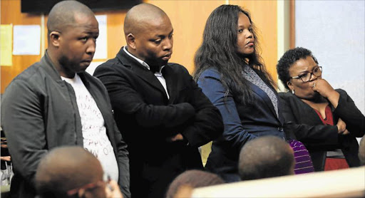 IN THE DOCK: Mayor of Amathole district municipality, Nomasikizi Konza, 53, right, in the dock with co-accused, from left: Sigcinile Saba, 31, Mawande Njeza, 30, and Nanziwe Rulashe, 36, in the East London Magistrate’s Court yesterday Picture: STEPHANIE LLOYD