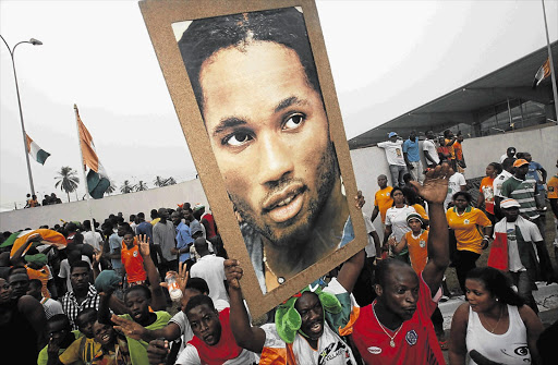 HEROES' WELCOME: Fans of Ivory Coast's Didier Drogba cheer him in Abidjan on the team's return from the Africa Cup of Nations soccer tournament in Gabon Picture: THIERRY GOUEGNON/REUTERS
