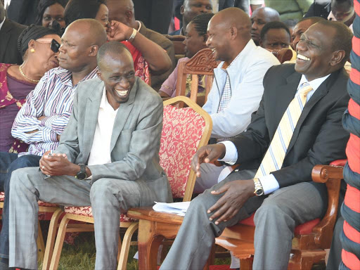Deputy President William Ruto with Cherangany MP Wesley Korir share a light moment during the launch of the last mile connectivity project at Sibanga Primary School on Saturday, October 29, 2016./DPPS