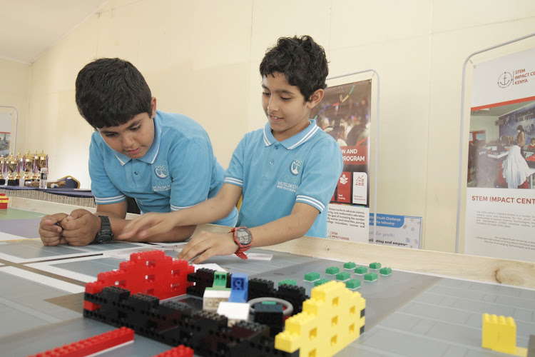 Qubaa Muslim School Grade 5 boys Omar Hassan and Alwi Hassan play magic numbers during the World Robot Olympiad competition at AFRALTI