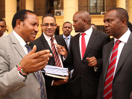 MP Ferdinand Waititu, lawyer Harrison Kinyanjui, Moses Kuria (Gatundu South) and Dennis Waweru (Dagoretti South) at Milimani law courts / PHILIP KAMAKYA