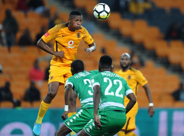 Siyabonga Ngezana of Chiefs in action with Tshepo Rikhotso and Ronald Pfumbidzai of Celtics during the Absa Premiership match between Kaizer Chiefs and Bloemfontein Celtic at FNB Stadium on February 24, 2018 in Johannesburg.