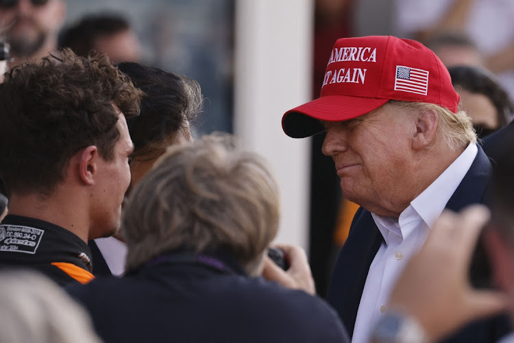 Former US President Donald Trump, right, talks with race winner McLaren driver Lando Norris at the Miami Grand Prix on May 5 2024 in Miami Gardens, Florida, US. Picture: PETER CASEY/USA TODAY SPORTS