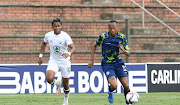 Thabo Mnyamane of Marumo Gallants challenges Siyethemba Sithebe of AmaZulu during their DStv Premiership match at King Zwelithini Stadium on November 4 2021 in Durban.