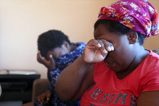 TRAUMATISED: Gcotyelwa Zwakala and her daughter Unathi, 13, who was injured when she was badly beaten by two women prophets at the Love of God Church in Tsomo Picture: SIBONGILE NGALWA