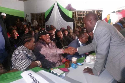 WELL DONE: Limuru Central mCa Njenga murugami congratulates Kabete MP-elect ferdinand Waititu on monday night at Wangige primary School. Photo/File