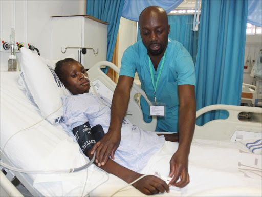 A patient being attended to by a doctor at the newly expanded Critical Care Unit at the Jaramogi Oginga Odinga Teaching and Referral Hospital. FILE