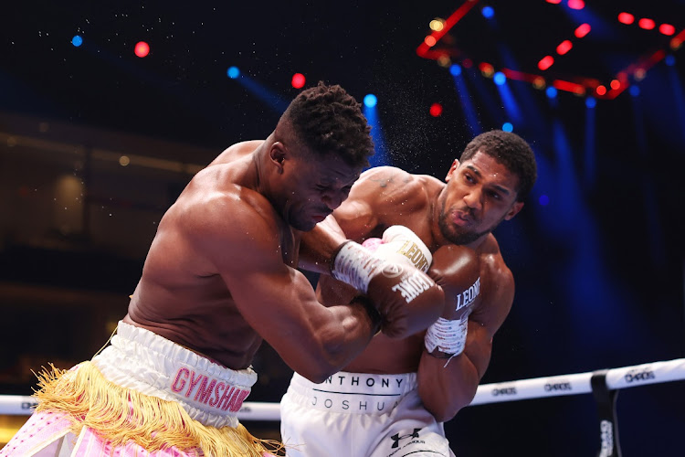 Anthony Joshua punches Francis Ngannou during their Heavyweight fight on the Knockout Chaos boxing card at the Kingdom Arena in Riyadh, Saudi Arabia, on Friday.