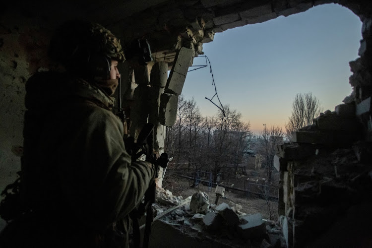 A Ukrainian serviceman looks on in Bakhmut, Donetsk, amid Russia's attack on the country.