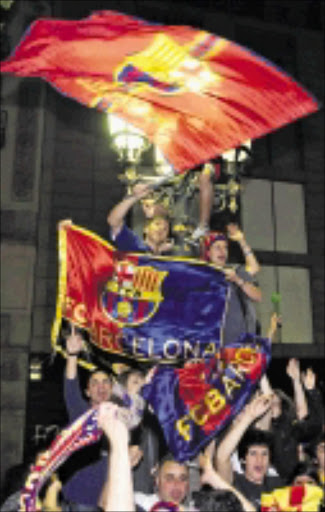 Barca supporters celebrate their team's victory. 17/05/09. Pic. Manu Fernandez. © AP.