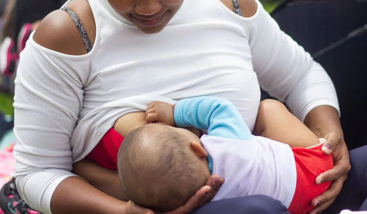 A mother breastfeeds her child in Bogota, Colombia