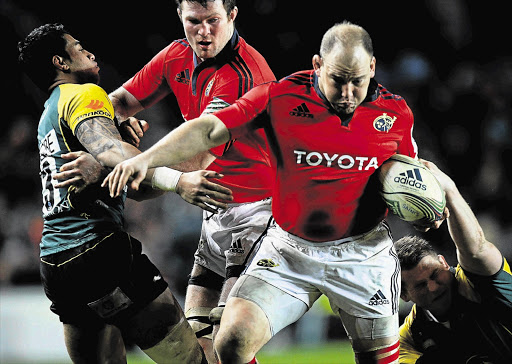 BJ Botha, playing for Irish team Munster, holds off George Pisi of Northampton. Botha might get a call-up for the Boks, whose coach is looking for a tighthead prop used to northern hemisphere rugby Picture: MATTHEW LEWIS/GALLO IMAGES