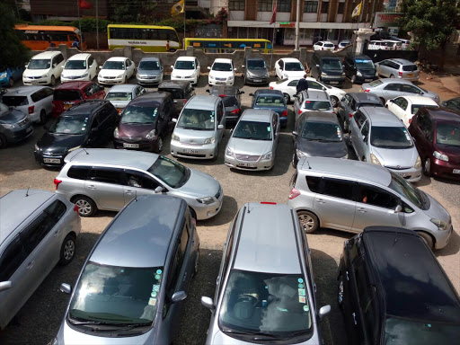 Uber taxis at a parking lot in Ngara, Nairobi. /COURTESY